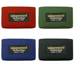 A group of four different colored wallets.