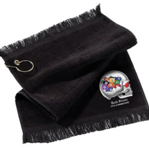 A black towel with a silver medal on top of it.