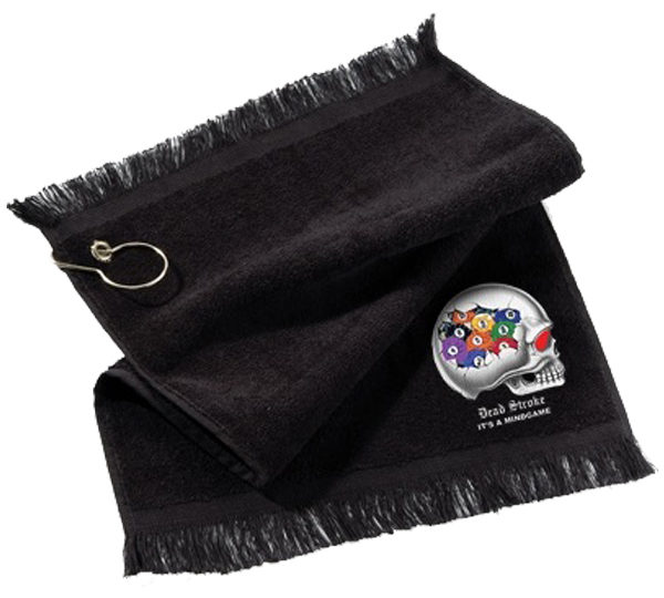 A black towel with a silver medal on top of it.